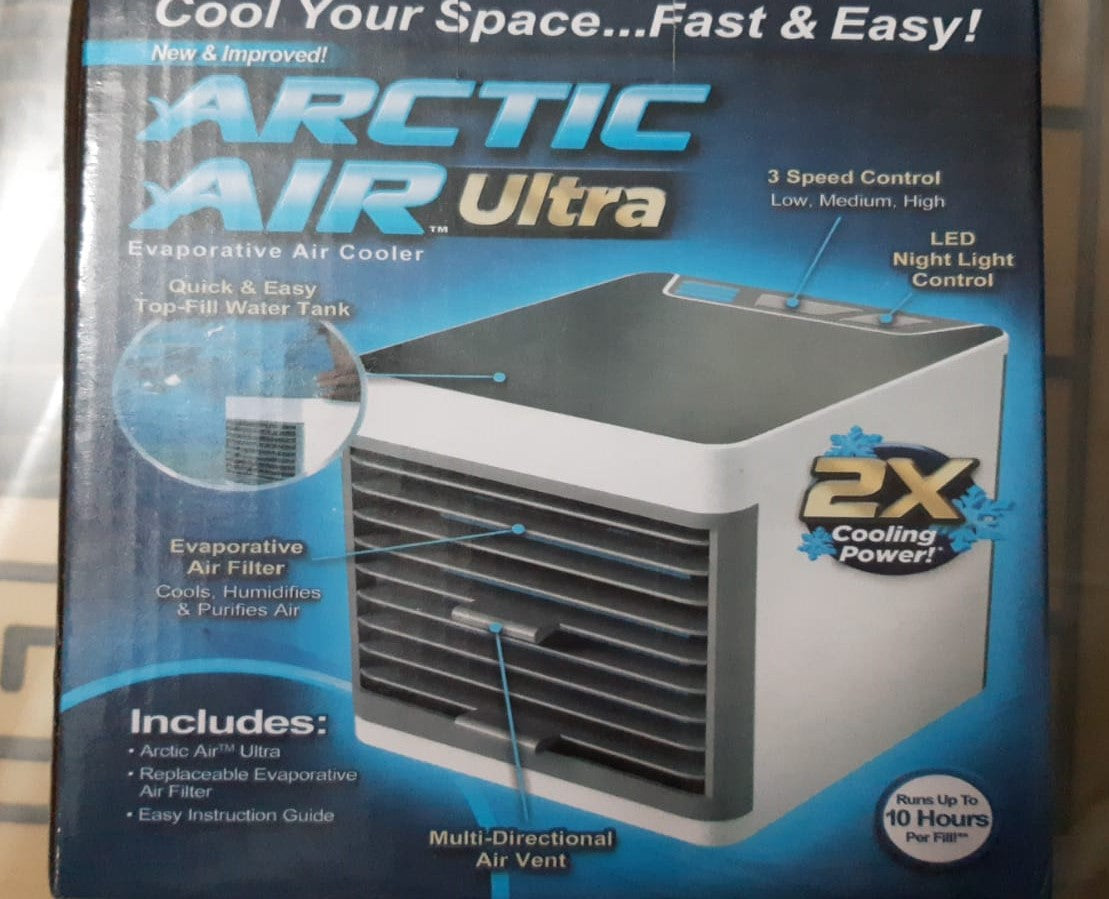 Arctic Air Ultra evaporative air cooler packaging with blue and black design.